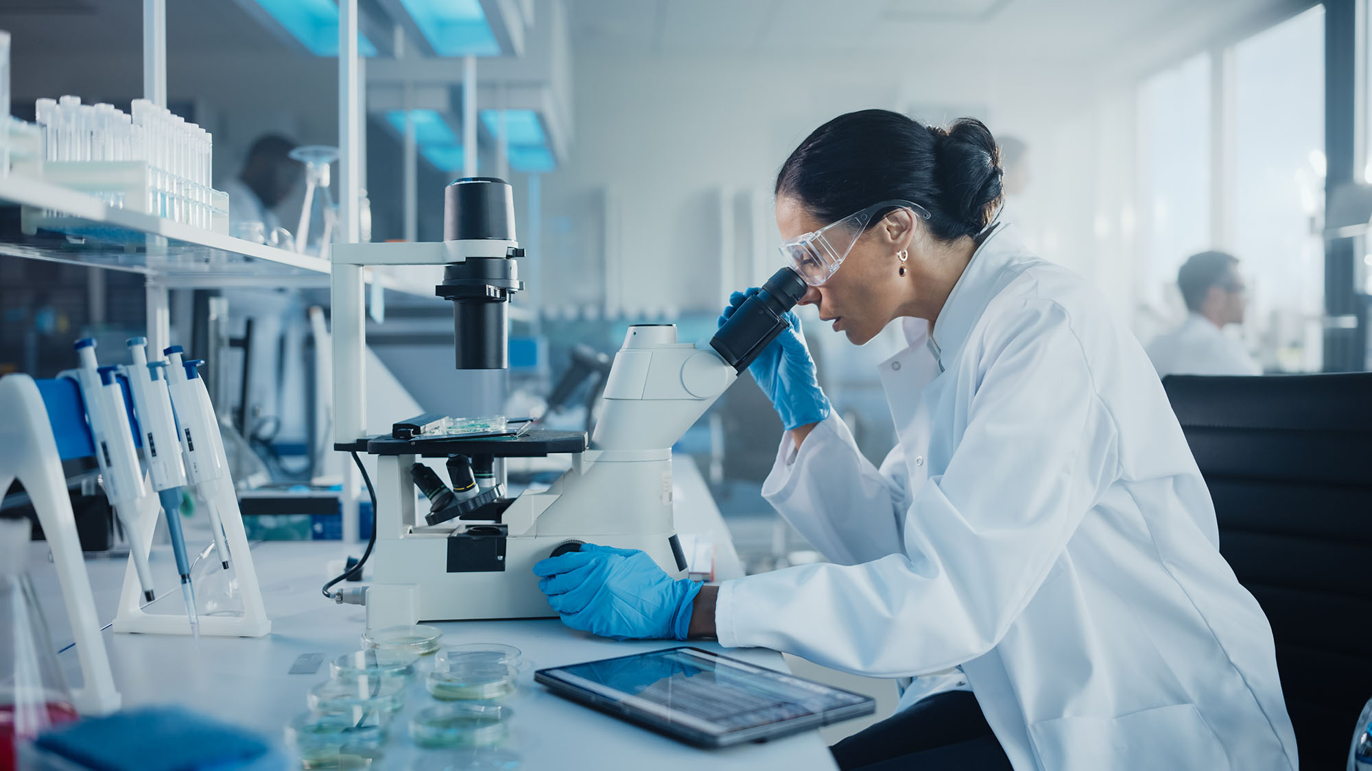 female scientist microscope